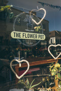 Flower pot workshop image showing participants creating floral arrangements at The Flower Pot Swindon LTD.