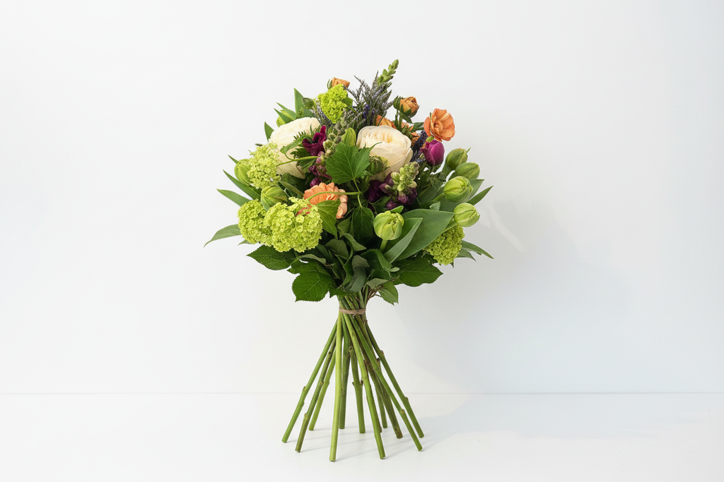 Spring Sunshine Bouquet from The Flower Pot Swindon LTD featuring vibrant mixed flowers in a lush bouquet arrangement.