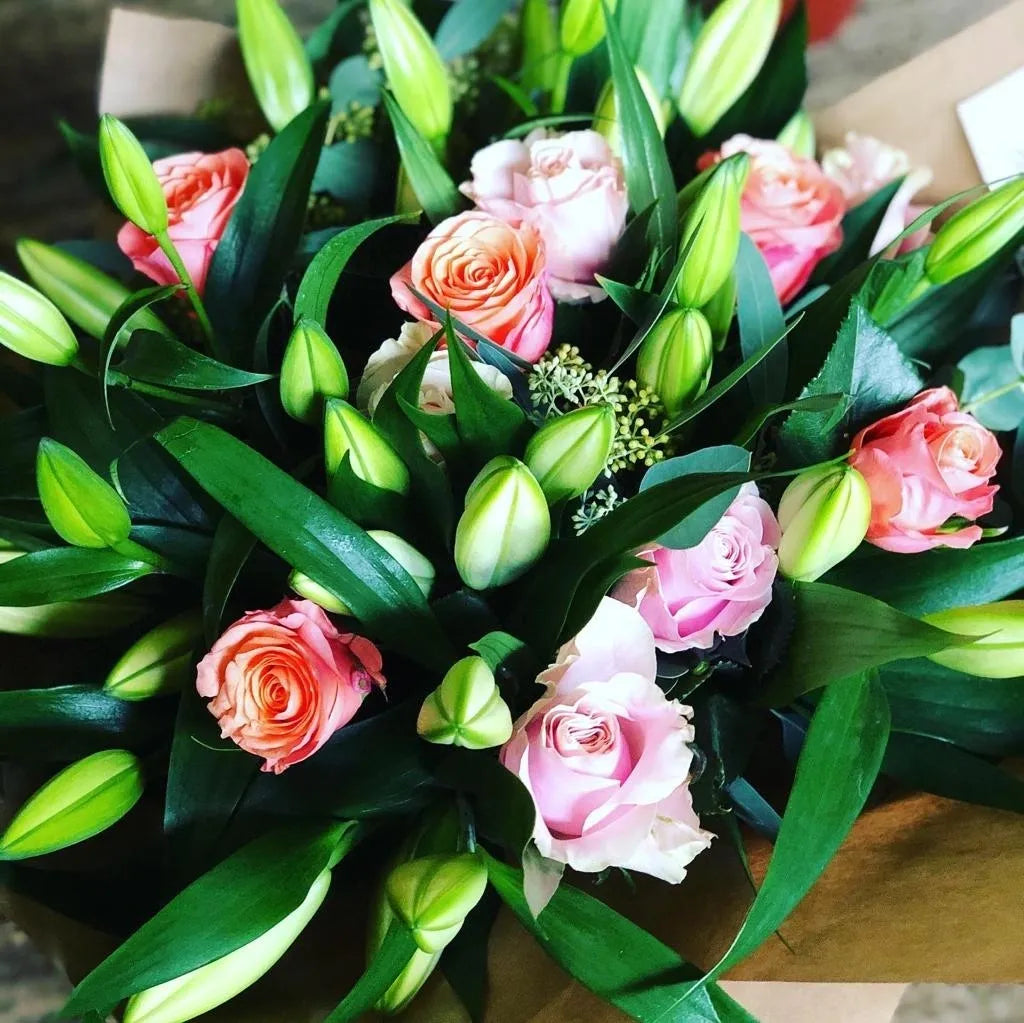 Beautiful bouquet of fresh roses and lilies from The Flower Pot Swindon LTD, showcasing vibrant blooms arranged in a floral bouquet.